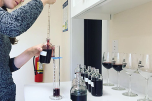 Chelsey Blevins tests the wine for various factors.